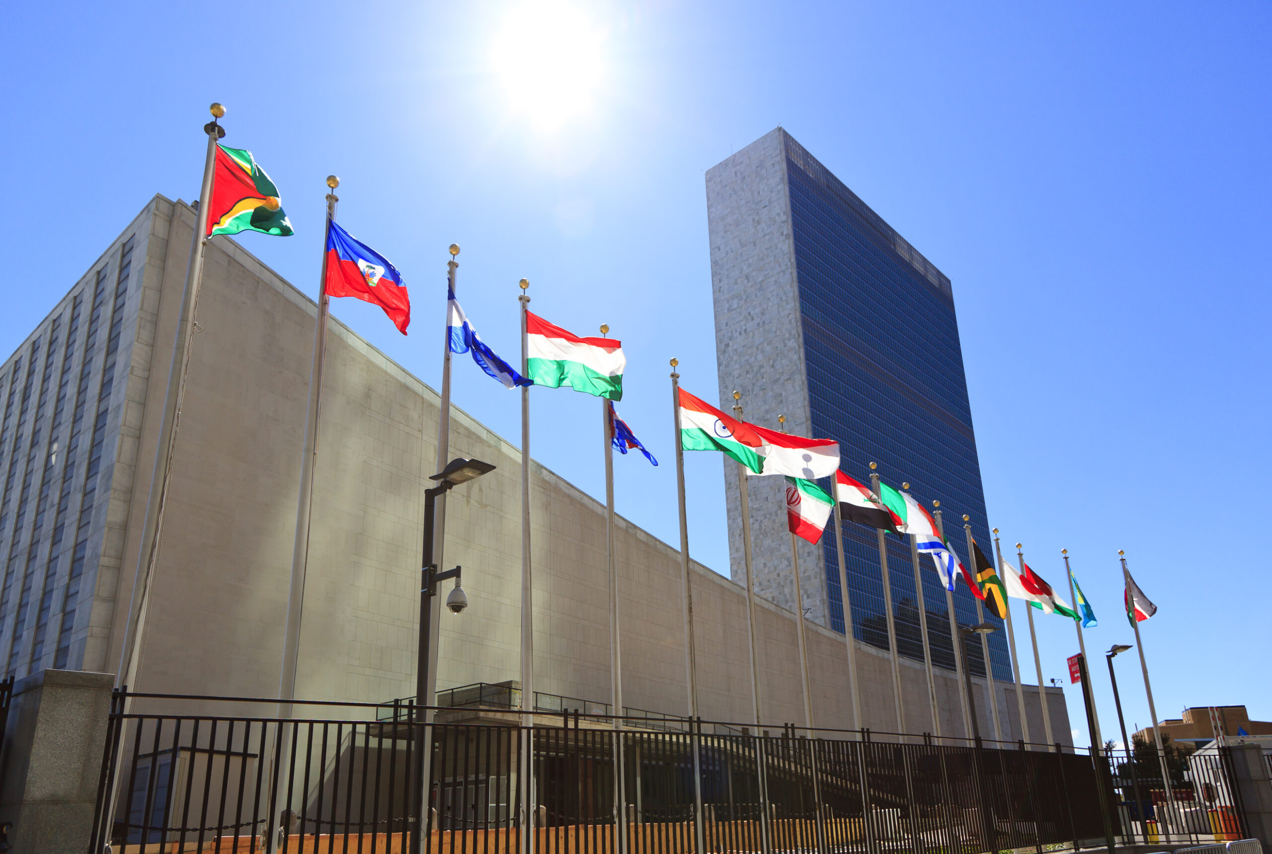 United Nations Headquarters with waving flags in New York, USA. Photo: mizoula / Getty Images﻿.